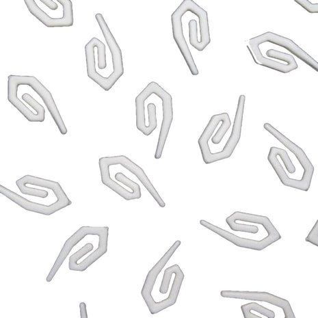 White plastic curtain hooks on a white background