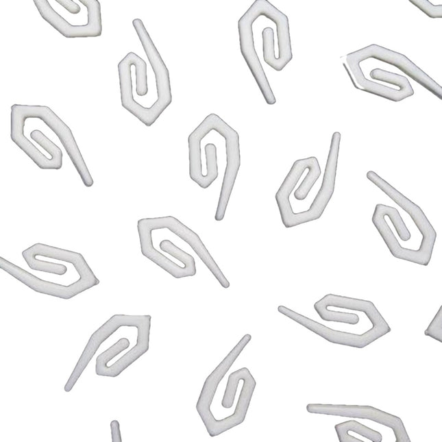 White plastic curtain hooks on a white background