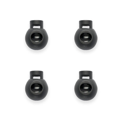 Four black cord lock cord ends on a white background