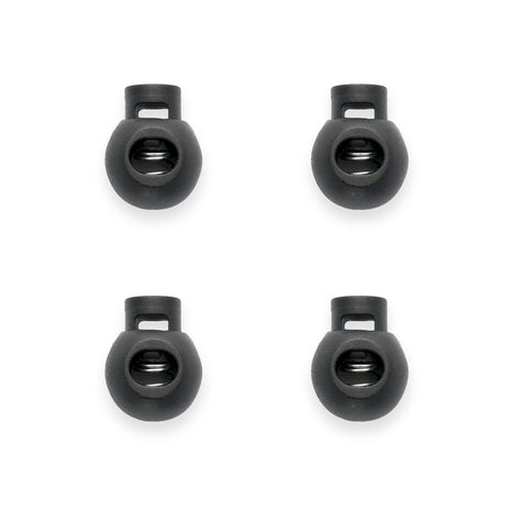Four black cord lock cord ends on a white background