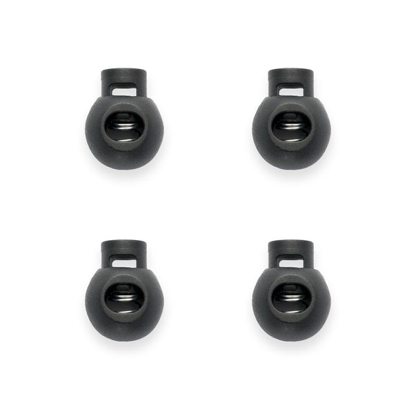 Four black cord lock cord ends on a white background