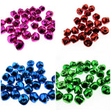 Four different colored jingle bells arranged in a grid on a white background.