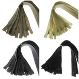 Four bundles of cushion zippers in different colors on a white background