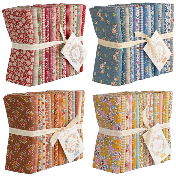 Four bundles of Tilda Creating memories floral fabric Fat Quarters with matching tags on a white background