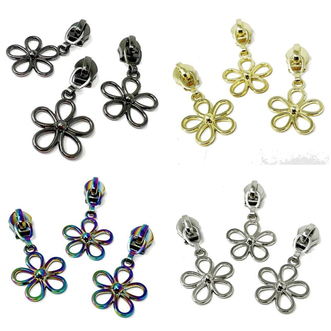 daisy Shaped Zip Sliders for No 5 zip chain metal finishes: black, yellow gold, iridescent rainbow, and silver, arranged on a plain white background.