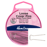 Pink packaging of Hemline loose cover pins with pins visible on a white background