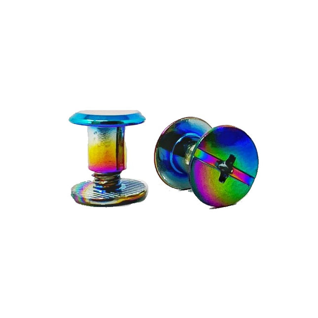 Two iridescent rainbow-colored metal Chicago screws on a plain white background, one standing upright and one lying on its side showing the flat back.
