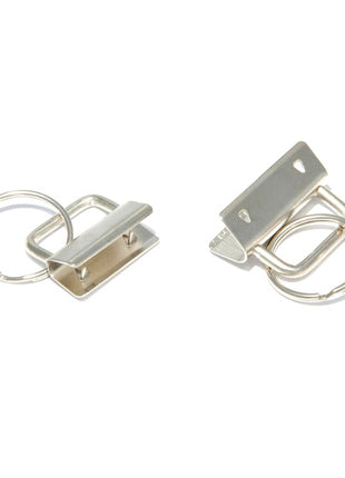 Two key fob split rings, one larger at 25mm and one smaller at 32mm, made of metal with a brushed finish, displayed against a white background.