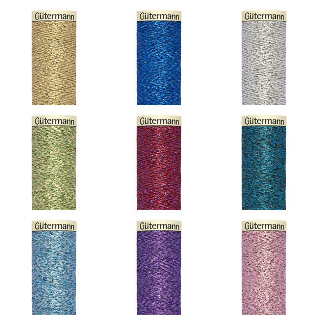 A collection of Gutermann metallic effect sewing thread in various colors displayed in individual reels.