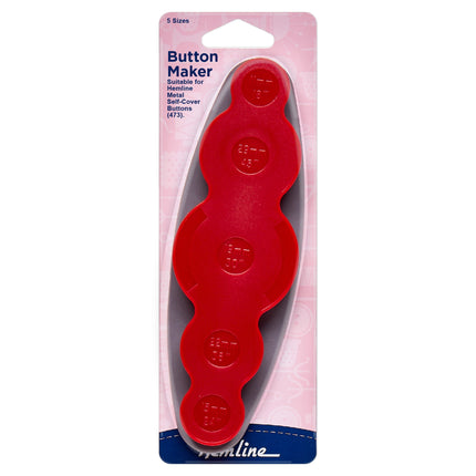 Red button maker tool in packaging with 'Hemline' branding on a white background
