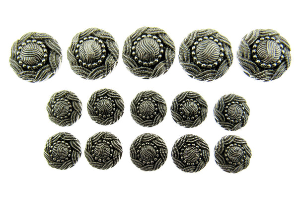A set of swirly antique silver buttons on a white background