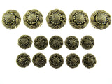 A set of antique gold swirly patterned buttons laid on a white background