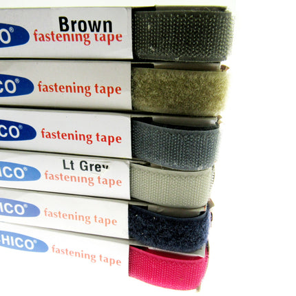 Stack of CHICO fastening tape packages in various colors on a white background