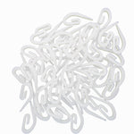 White plastic hooks on a white background