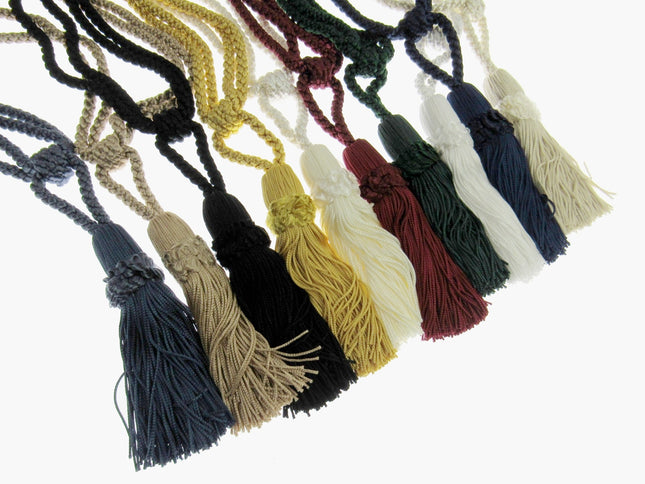 Set of colorful curtain tie back tassels on a white background