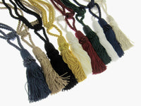 Set of colorful curtain tie back tassels on a white background
