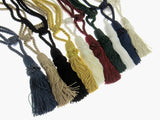 Set of colorful curtain tie back tassels on a white background