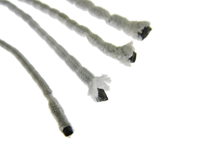 Close-up of multiple curtain lead weight tapes covered in white polyester tape on a white background