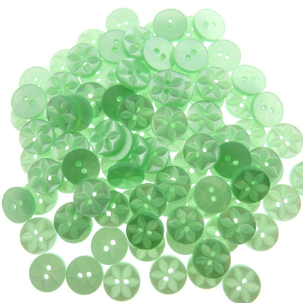 An array of colorful round star-shaped baby buttons in various colors including green, orange, pink, purple, yellow, and clear.