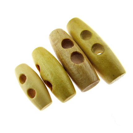 A set of beige wooden toggles with two drilled holes each, arranged in a row on a white background.