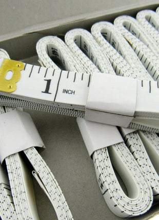 Set of white tape measures on a white background