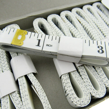 Set of white tape measures on a white background