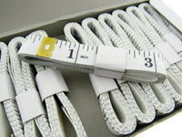 Set of white tape measures on a white background