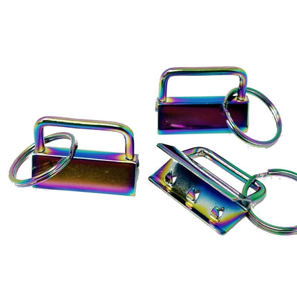 Three metallic keychain lock charms with iridescent rainbow finishes, shown on a plain white background.