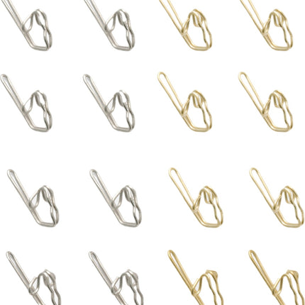 Brass and Zinc Curtain hooks on a white background