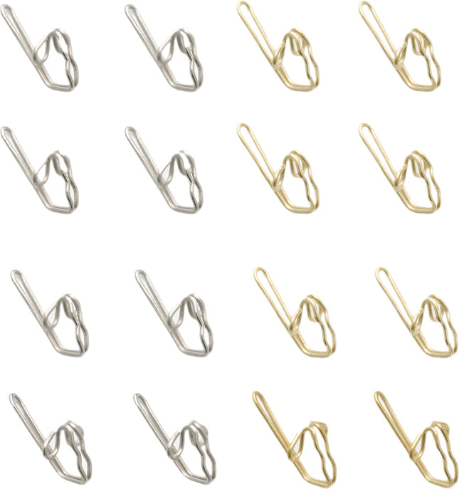 Brass and Zinc Curtain hooks on a white background