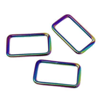 Three rectangular open jump rings with an iridescent rainbow finish, displayed on a clean white background.