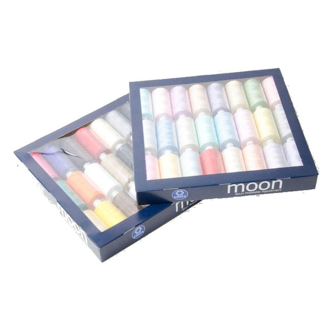 Pastel and bright coloured thread spools with 'moon' branding on a white background