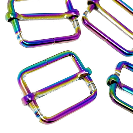 Four metallic square hardware loops with an iridescent rainbow finish, shown on a plain white background.