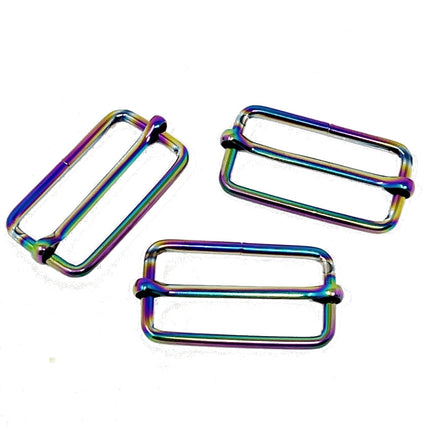 Three metallic rectangular hardware loops with an iridescent rainbow finish, arranged on a plain white background.