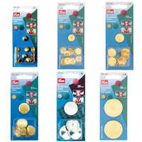 An array of Prym metal self cover buttons on a white background