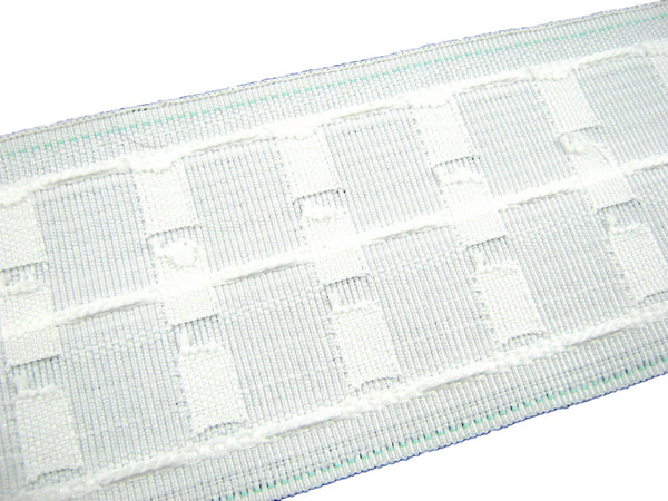 Close-up of a woven white premium curtain ape on a white background