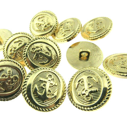 Gold anchor buittons on a white background