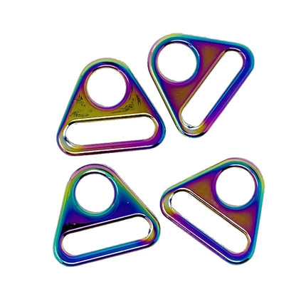 Four triangular metal rings with a colorful iridescent rainbow finish, arranged on a plain white background.