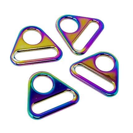 Four triangular metal hardware pieces with a glossy iridescent rainbow finish, arranged on a plain white background.