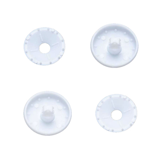 Four white plastic self cover buttons on a white background