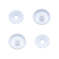 Four white plastic self cover buttons on a white background