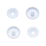 Four white plastic self cover buttons on a white background