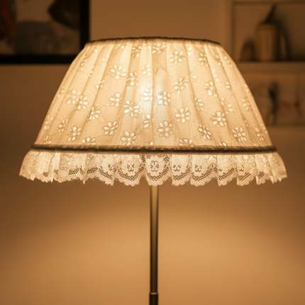 White broderie anglaise lampshade with frilled nylon lace trim — close-up