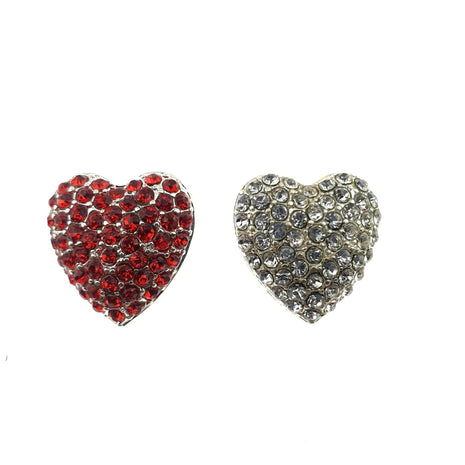 Two heart-shaped diamante buttons with shank, one with red crystals and one with clear crystals, against a white background.