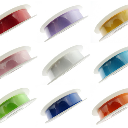 Assortment of colorful satin ribbons with woven edges on spools, displayed in a grid layout.