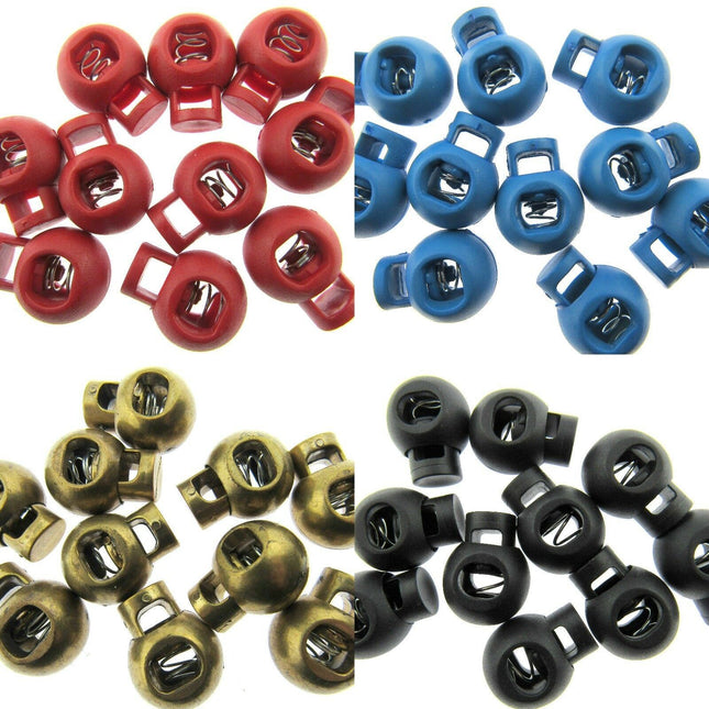 A collection of plastic cord lock end toggles with metal springs in various colors including red, blue, gold, black, and bronze.
