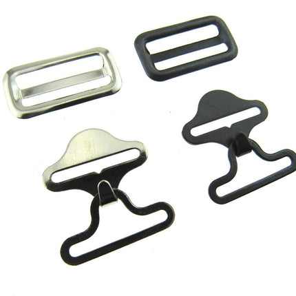 A set of bow tie clips in black and silver colors, including different styles of clips typically used for securing bow ties on clothing.
