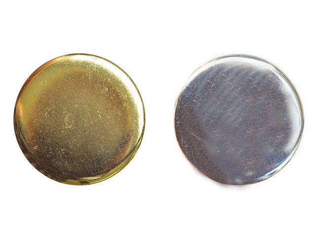 Two round metal blazer buttons, one polished gold and one polished silver, with a shank attachment.