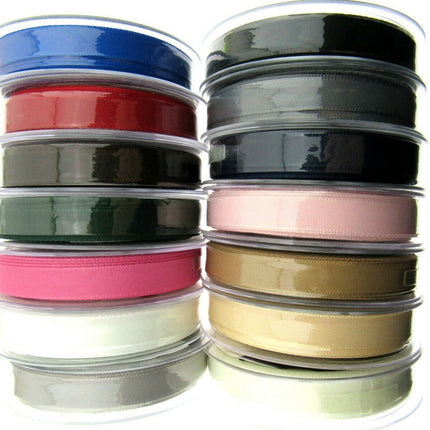 Reels of Berisfords polyester seam binding tape in various colors, displayed vertically.