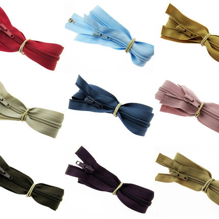 A collection of 19 inch nylon open end zips in various colors including red, blue, green, beige, pink, purple, brown, black, and gray.
